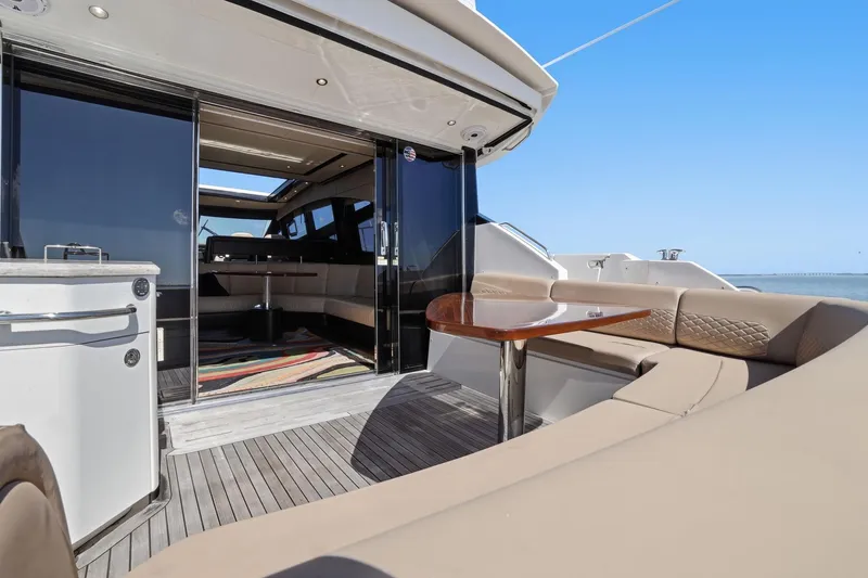 Slide: The Image of Luxurious 2017 Sea Ray L590 yacht with elegant outdoor seating and sleek interior design. - 43