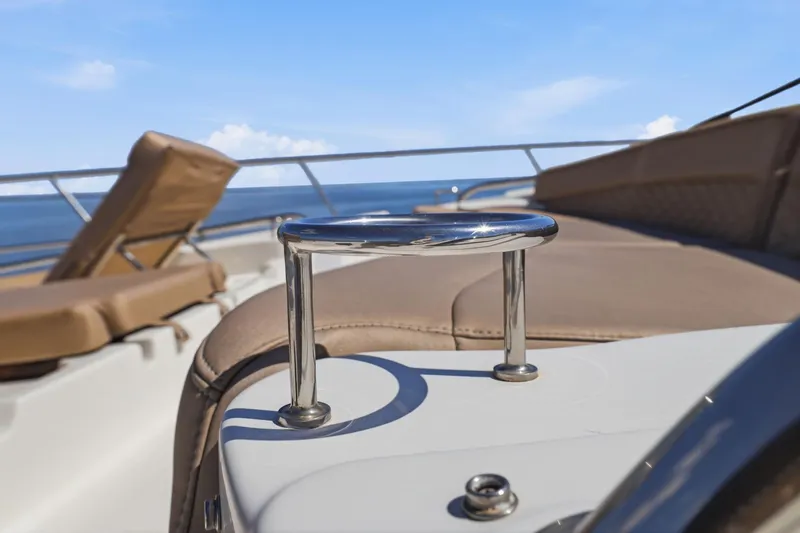 Slide: The Image of 2017 Sea Ray L590 yacht deck with sun loungers and ocean view. - 47