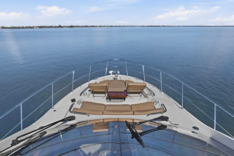 Slide: The Image of 2017 Sea Ray L590 yacht cruising on calm waters under a clear sky. - 50
