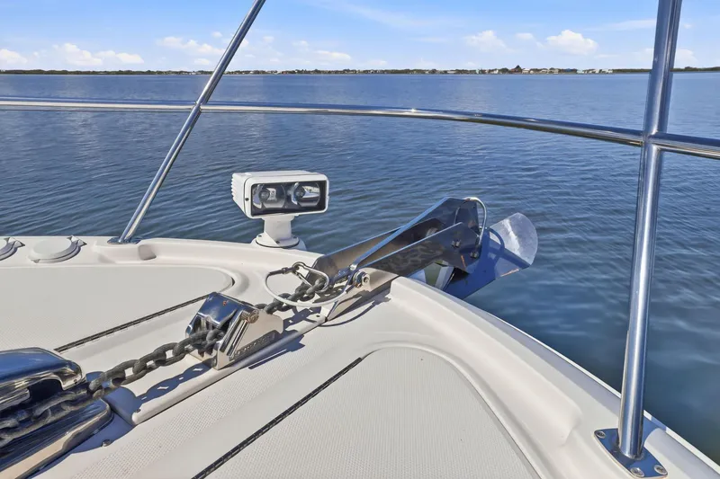 Slide: The Image of Bow of 2017 Sea Ray L590 yacht with anchor and calm ocean view. - 51