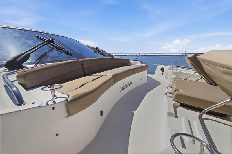 Slide: The Image of Luxurious 2017 Sea Ray L590 yacht deck with comfortable seating and ocean view. - 56