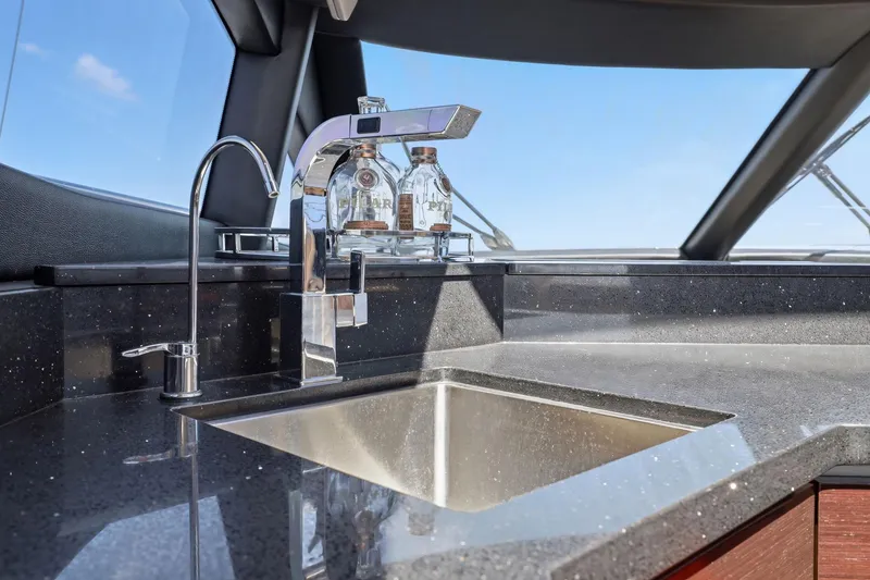 Slide: The Image of Luxurious kitchen sink area on 2017 Sea Ray L590 yacht with modern fixtures. - 58