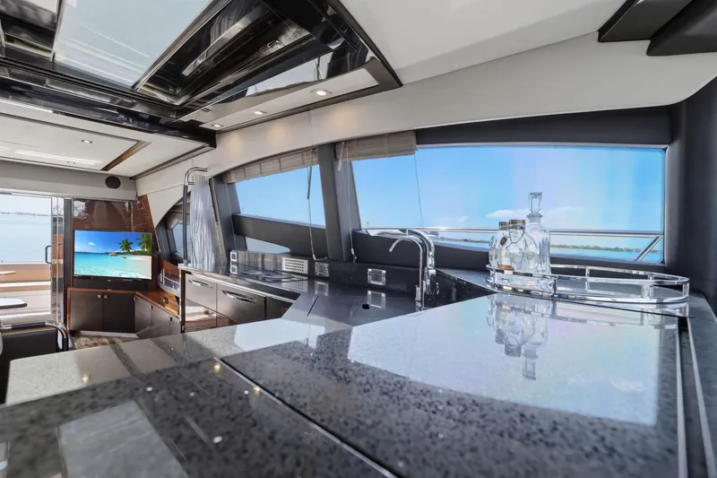 Slide: The Image of Luxurious interior of 2017 Sea Ray L590 yacht with modern kitchen and ocean view. - 60