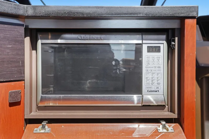 Slide: The Image of Cuisinart microwave in 2017 Sea Ray L590 yacht kitchen. - 62