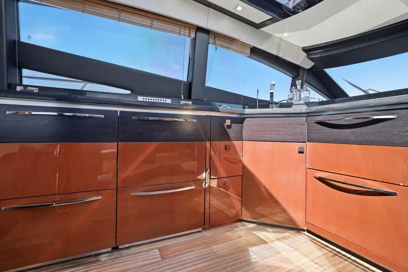 Slide: The Image of Luxurious interior of 2017 Sea Ray L590 yacht with sleek cabinetry and modern design. - 64