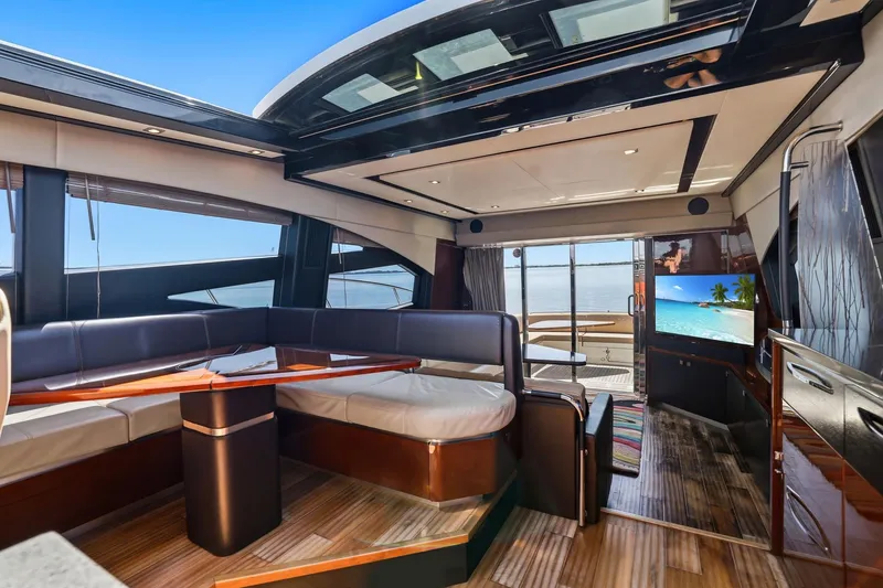 Slide: The Image of Luxurious interior of 2017 Sea Ray L590 yacht with elegant seating and ocean view. - 65