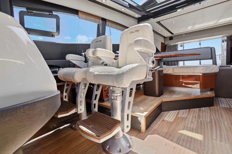 Slide: The Image of Luxurious interior of 2017 Sea Ray L590 yacht with plush seating and elegant wood flooring. - 68