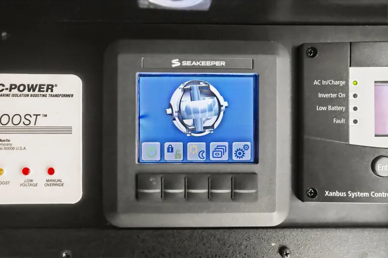 Slide: The Image of Control panel of a 2017 Sea Ray L590 yacht featuring Seakeeper and power systems. - 69
