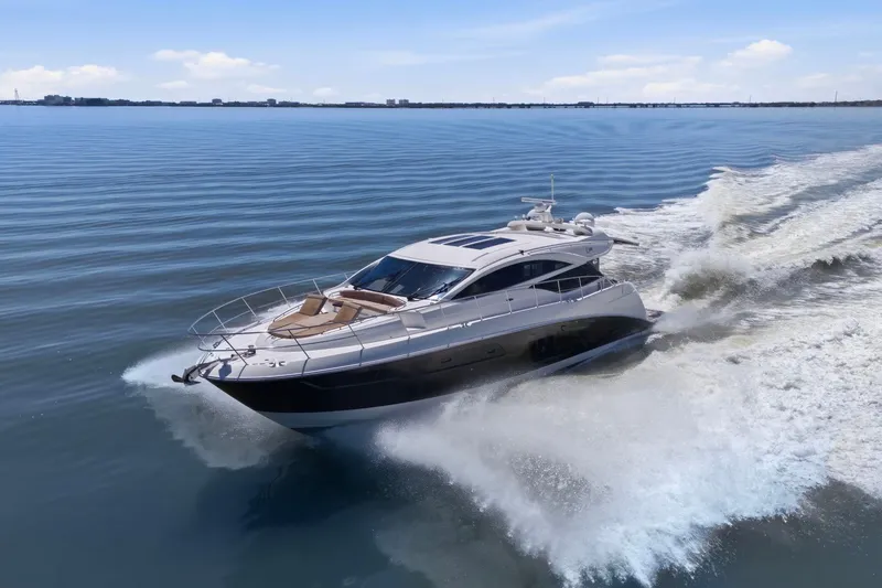 Slide: The Image of 2017 Sea Ray L590 yacht cruising on calm waters under a clear sky. - 7