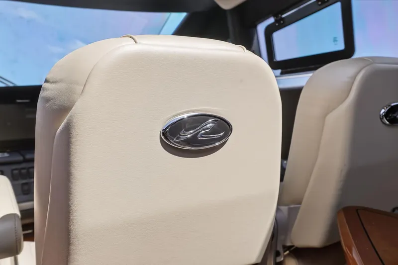 Slide: The Image of Interior of 2017 Sea Ray L590 yacht with beige leather seating. - 71