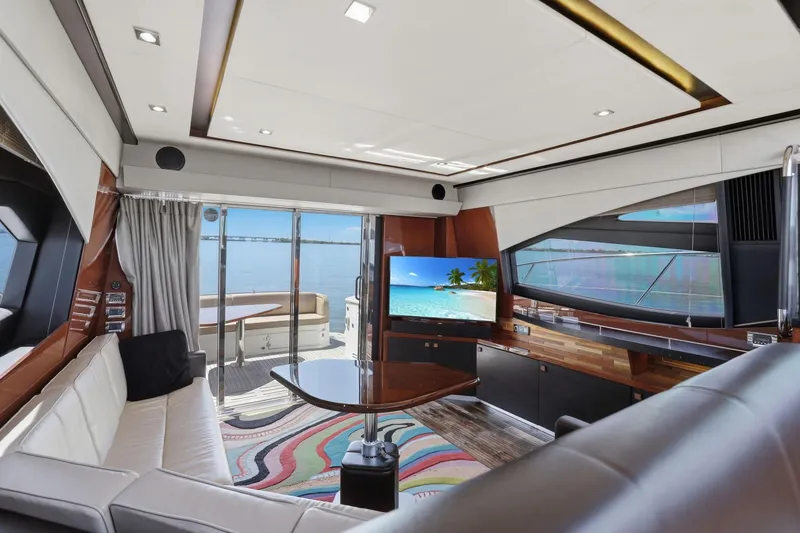 Slide: The Image of Luxurious interior of 2017 Sea Ray L590 yacht with modern furnishings and scenic ocean view. - 78