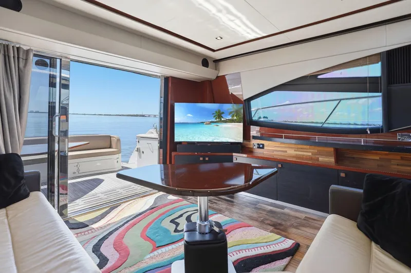 Slide: The Image of Luxurious interior of 2017 Sea Ray L590 yacht with ocean view and modern decor. - 80