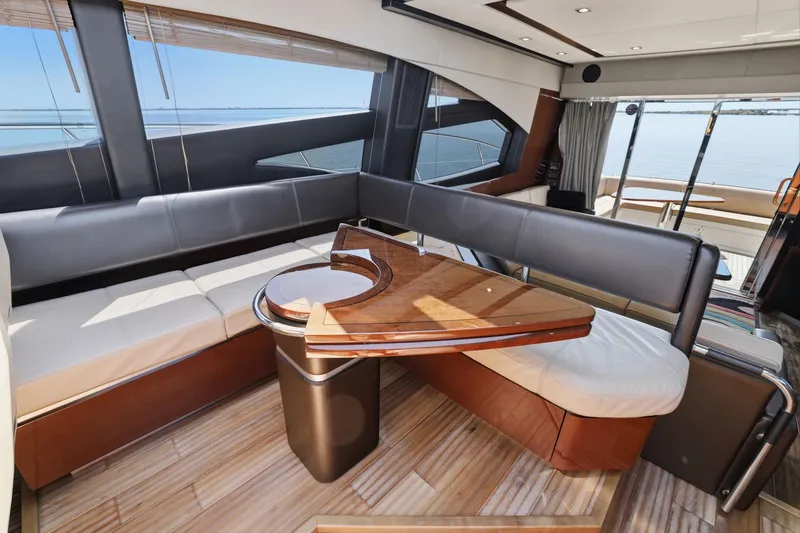 Slide: The Image of Luxurious interior of 2017 Sea Ray L590 yacht with elegant seating and wooden table. - 82