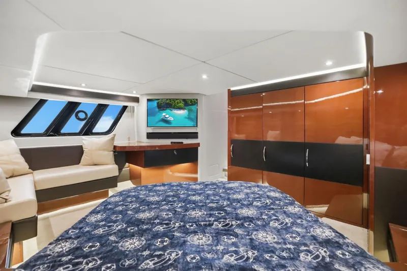 Slide: The Image of Luxurious 2017 Sea Ray L590 yacht cabin with modern decor and entertainment system. - 90