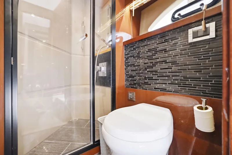 Slide: The Image of Luxurious bathroom in 2017 Sea Ray L590 yacht with modern shower and sleek design. - 94