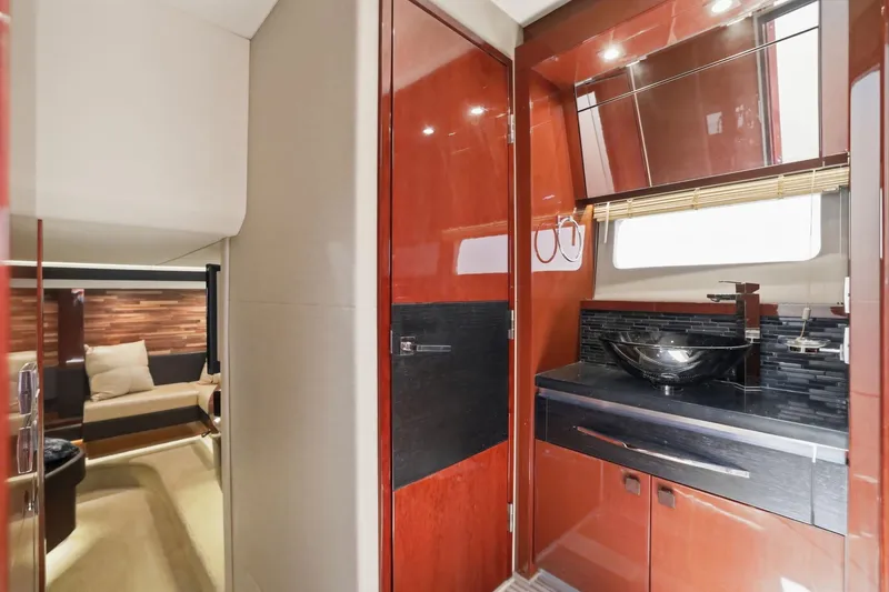 Slide: The Image of Luxurious interior of 2017 Sea Ray L590 yacht featuring modern bathroom and cozy seating area. - 96
