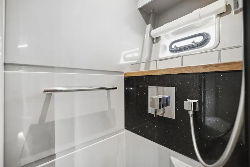 Slide: The Image of Luxurious bathroom interior of 2017 Sea Ray L590 yacht with modern fixtures. - 98