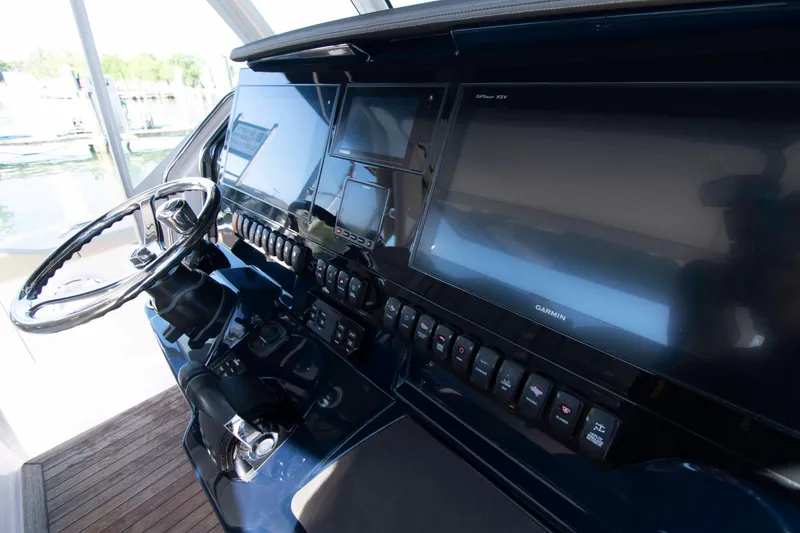 Slide: The Image of Helm of 2019 Pursuit S 408 Sport boat with Garmin displays and controls. - 13