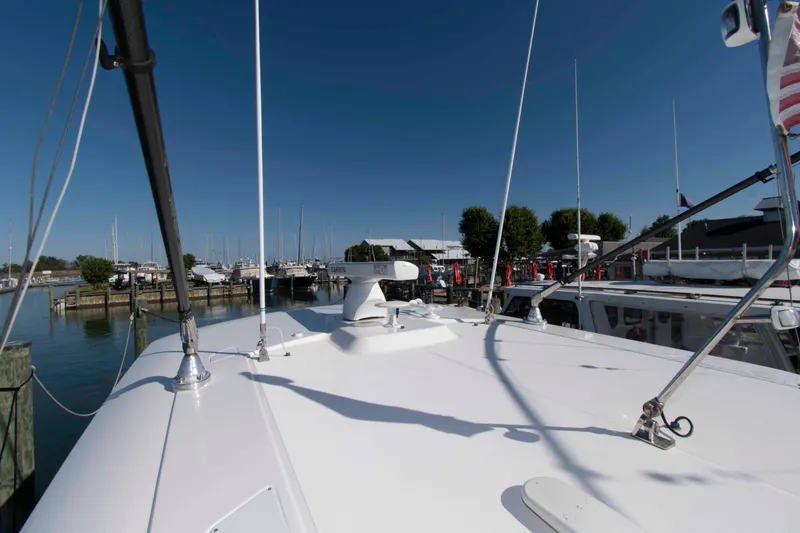 Slide: The Image of 2019 Pursuit S 408 Sport boat docked at marina under clear blue sky. - 28