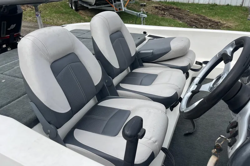 Slide: The Image of 2008 Stratos 176 XT boat interior with dual seats and steering wheel. - 9