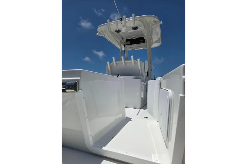 Slide: The Image of 2026 Parker 254 FATHOM boat interior with sleek white design under clear blue sky. - 5