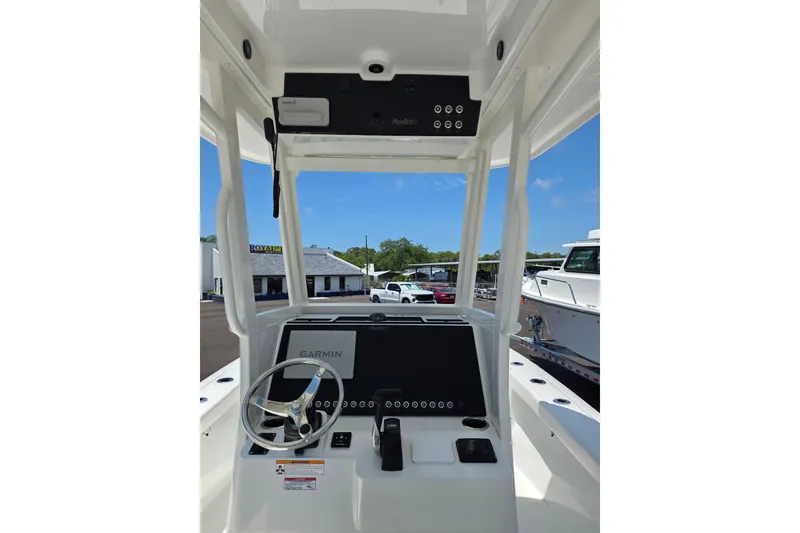 Slide: The Image of 2026 Parker 254 FATHOM boat helm with Garmin navigation system and steering wheel. - 6
