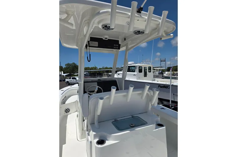 Slide: The Image of 2026 Parker 254 FATHOM boat interior with rod holders and helm station. - 7