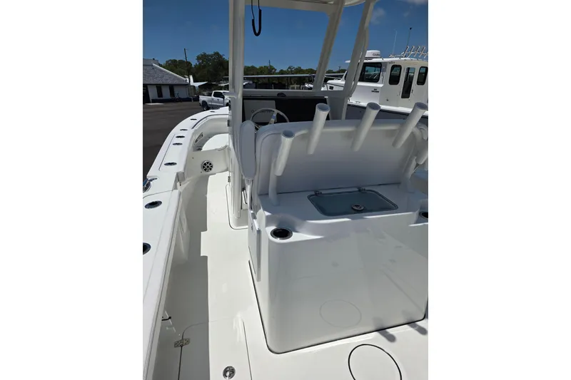 Slide: The Image of 2026 Parker 254 FATHOM boat interior with rod holders and seating area. - 8