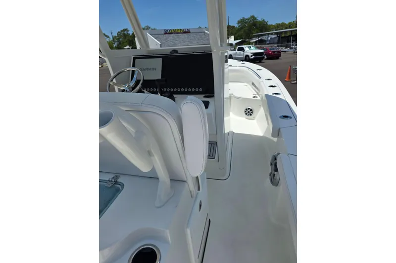 Slide: The Image of 2026 Parker 254 FATHOM boat interior with Garmin navigation system and sleek white design. - 9
