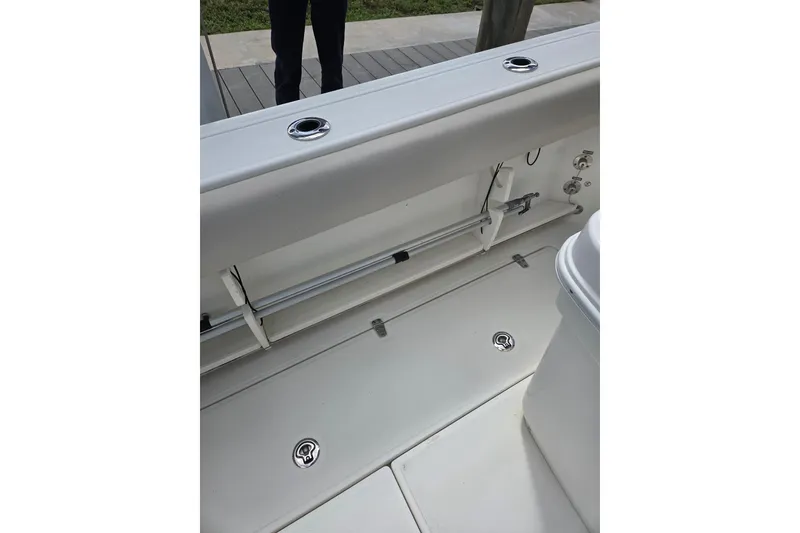 Slide: The Image of 2017 Boston Whaler 250 Outrage boat interior, showcasing deck and storage features. - 11