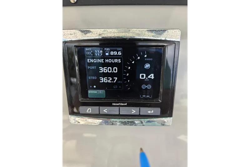 Slide: The Image of Display screen on 2017 Boston Whaler 250 Outrage showing engine hours and fuel level. - 15