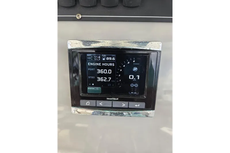 Slide: The Image of Dashboard display of a 2017 Boston Whaler 250 Outrage showing engine hours and fuel levels. - 16