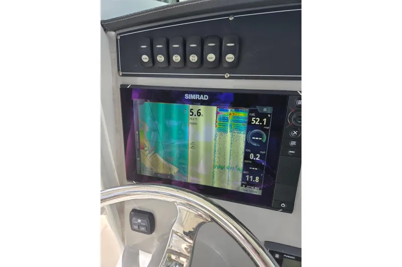 Slide: The Image of Simrad display on 2017 Boston Whaler 250 Outrage boat dashboard. - 17