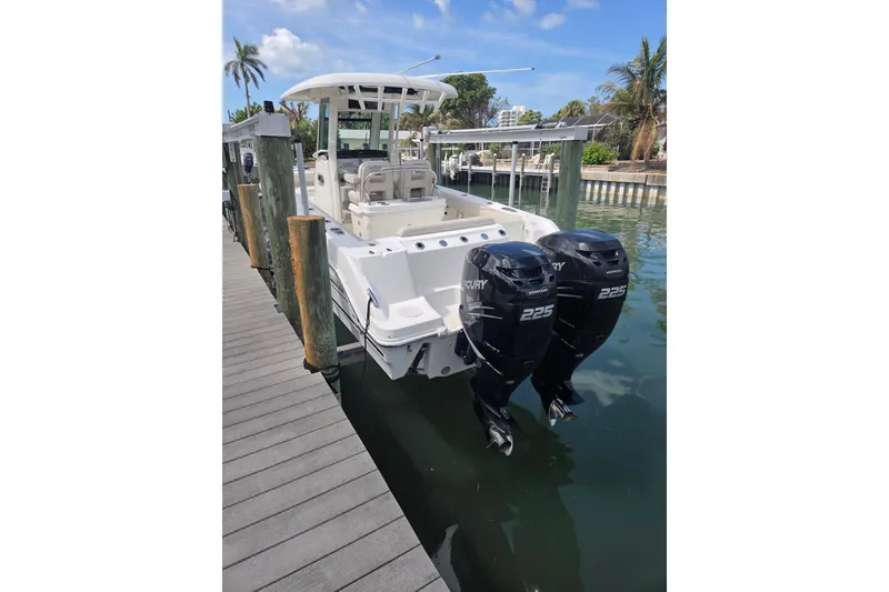 Slide: The Image of 2017 Boston Whaler 250 Outrage with twin Mercury 225 engines at dock. - 2