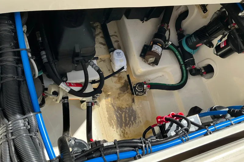 Slide: The Image of 2017 Boston Whaler 250 Outrage engine compartment with wiring and components. - 24