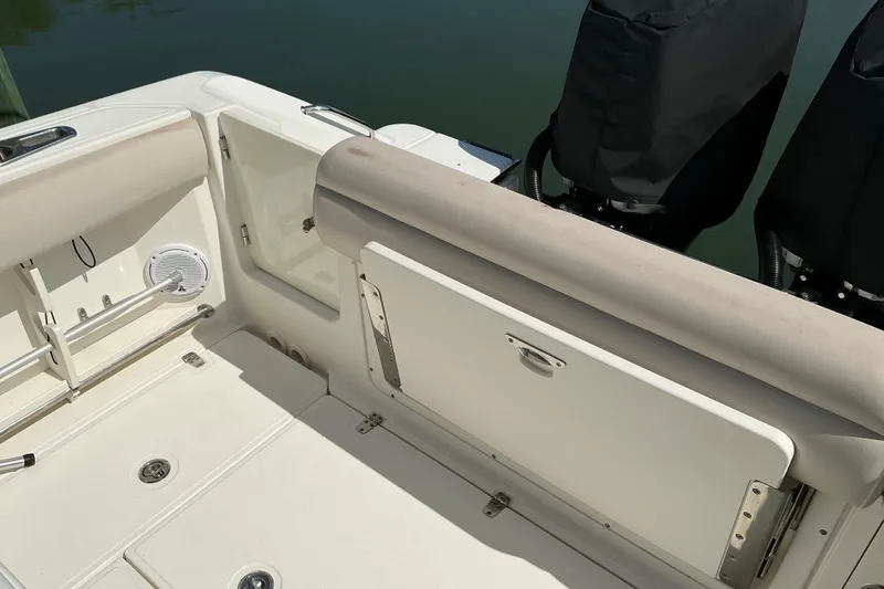 Slide: The Image of 2017 Boston Whaler 250 Outrage boat interior with seating and storage compartments. - 26