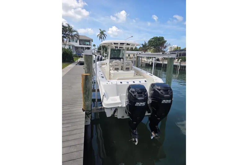 Slide: The Image of 2017 Boston Whaler 250 Outrage docked with twin Mercury 225 engines. - 3