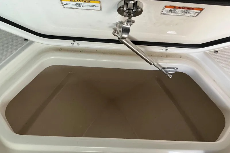 Slide: The Image of Open storage compartment on a 2017 Boston Whaler 250 Outrage boat. - 32