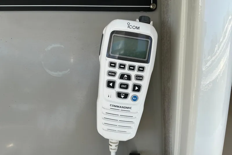 Slide: The Image of ICOM CommandMic on 2017 Boston Whaler 250 Outrage boat dashboard. - 34