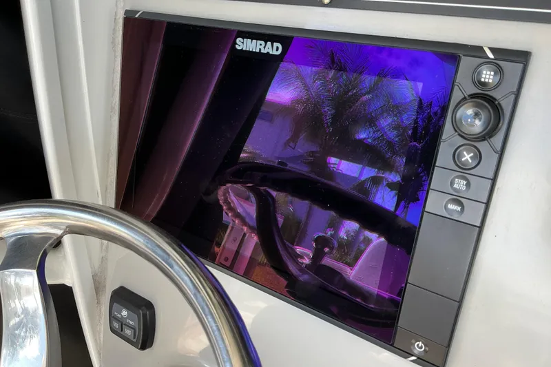 Slide: The Image of Simrad display on 2017 Boston Whaler 250 Outrage boat, reflecting palm trees. - 39