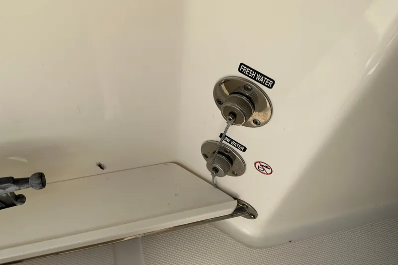 Slide: The Image of Boston Whaler 250 Outrage 2017 boat water inlets labeled fresh and raw water. - 43