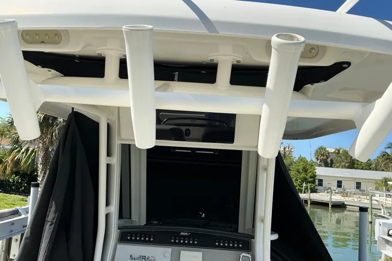 Slide: The Image of 2017 Boston Whaler 250 Outrage boat console with rod holders and electronics. - 46