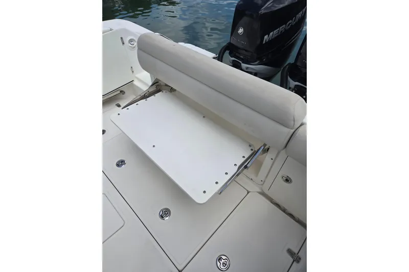 Slide: The Image of 2017 Boston Whaler 250 Outrage boat seat with foldable bench and Mercury engine. - 7