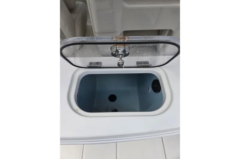 Slide: The Image of Livewell compartment on a 2017 Boston Whaler 250 Outrage boat, open lid view. - 8