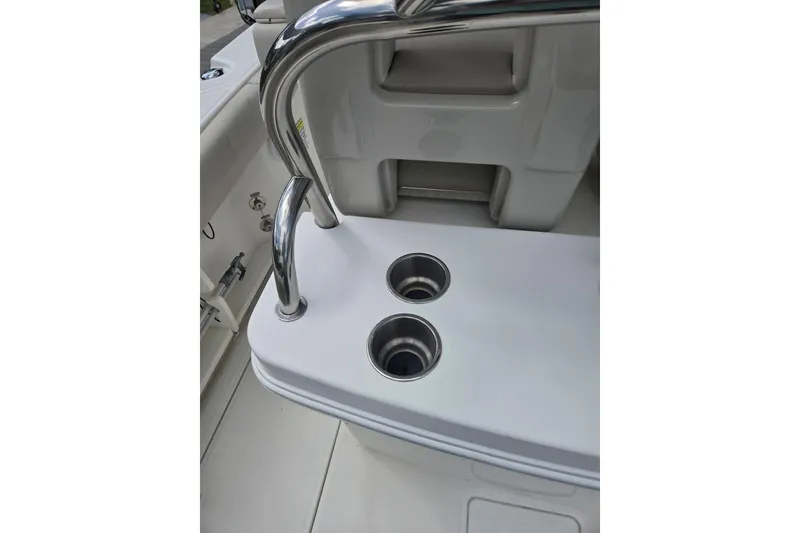 Slide: The Image of 2017 Boston Whaler 250 Outrage boat interior with stainless steel cup holders. - 9