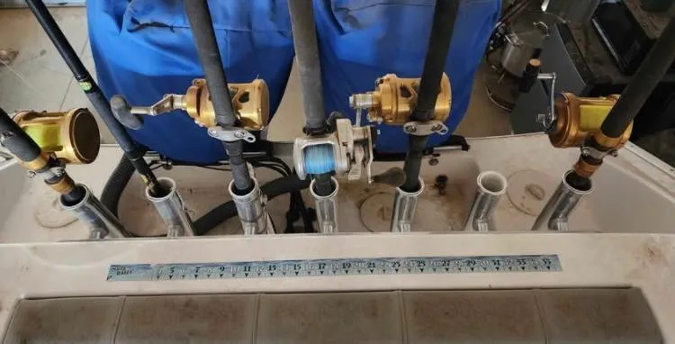 Slide: The Image of Fishing rods and reels on a 2020 Cape Horn 27 XS boat. - 11