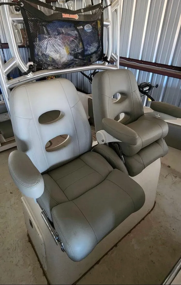 Slide: The Image of 2020 Cape Horn 27 XS boat seats in storage, featuring gray cushioned design. - 7