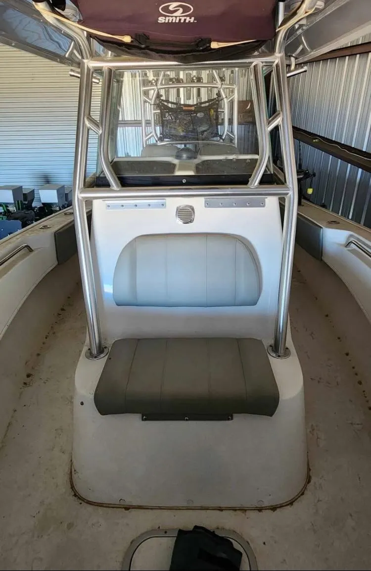 Slide: The Image of 2020 Cape Horn 27 XS boat interior with seating and console in storage. - 8