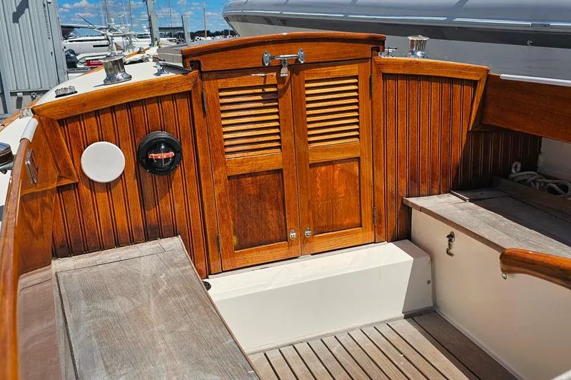 Slide: The Image of Wooden cockpit of 2003 Herreshoff Alerion 26 sailboat with polished finish. - 5