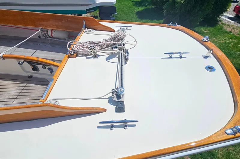 Slide: The Image of 2003 Herreshoff Alerion 26 sailboat deck with wooden trim and rigging. - 7
